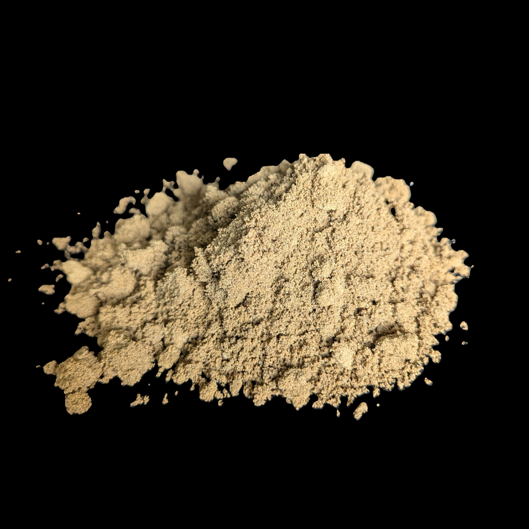 A large pile of gravel is sitting on top of a train track.
