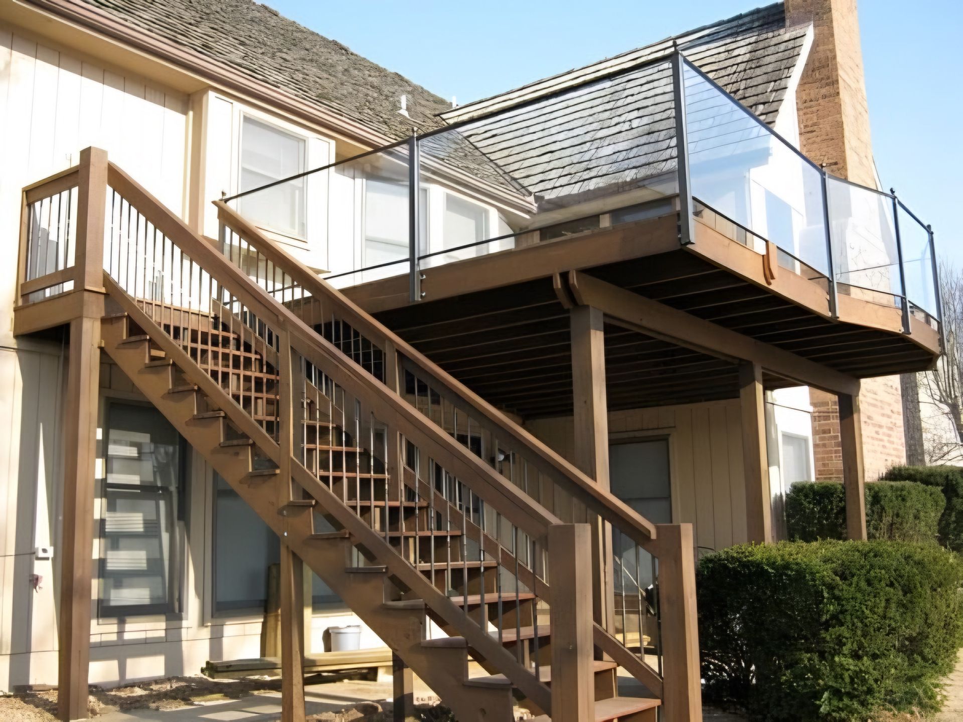 A wooden deck with stairs leading up to it