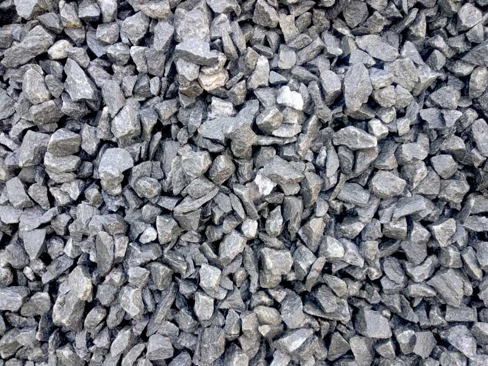 Pile of gray Gravel is Sitting on the ground — Ian Brown Sand Supplies and Tipper Hire In Laurieton, NSW
