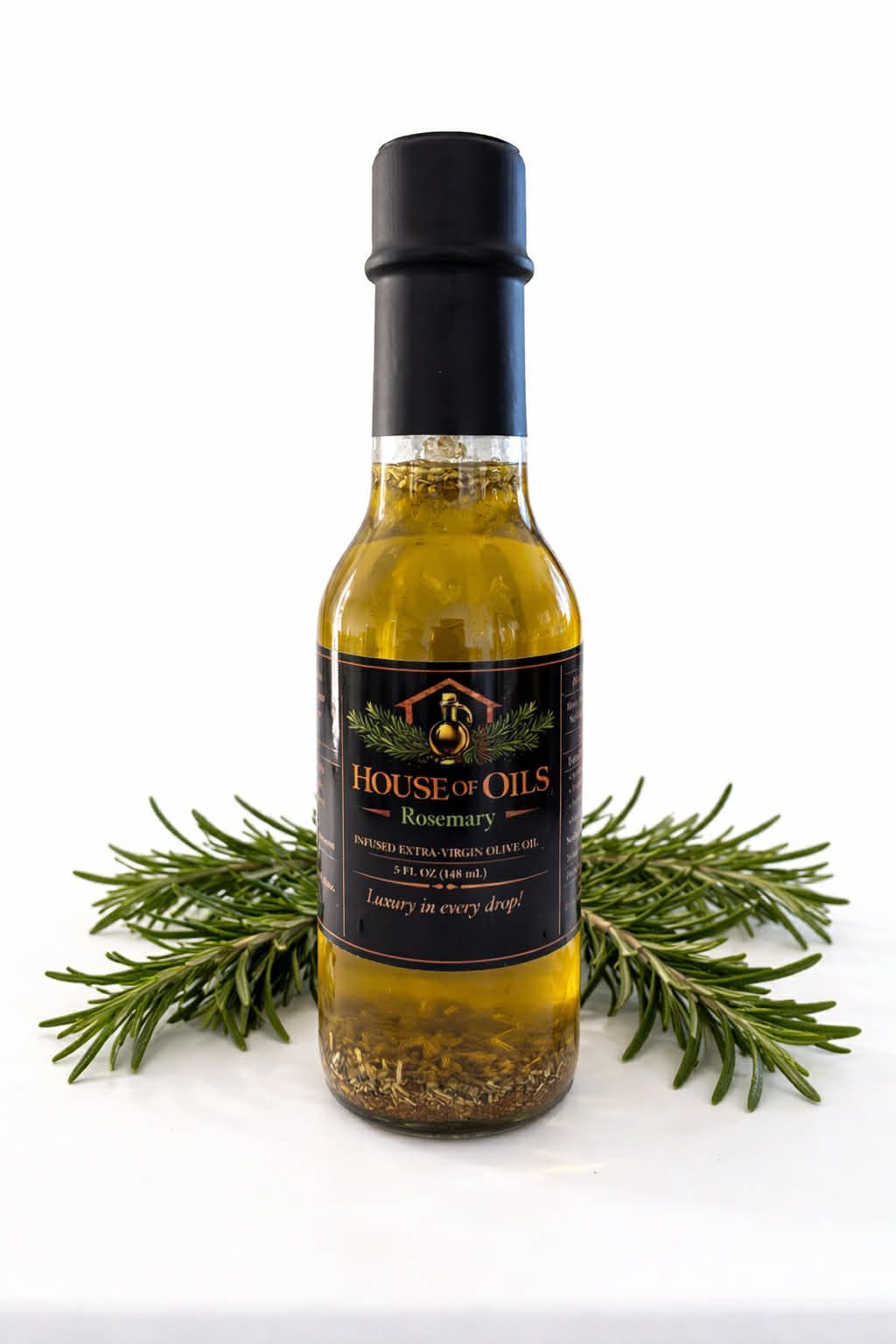 Bottle of rosemary-infused olive oil with sprigs of rosemary on a white background