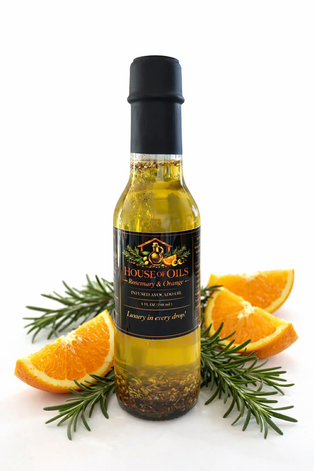 Bottle of olive oil with orange slices and rosemary sprigs on a white background