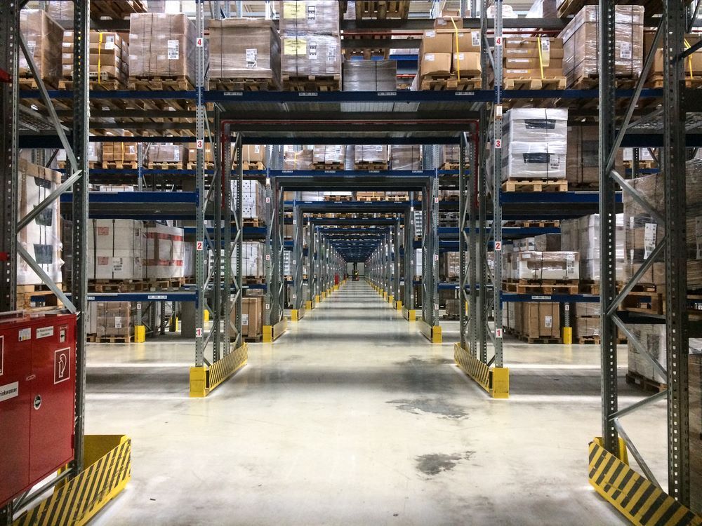 A Large Warehouse Filled With Lots of Shelves and Boxes — Kingaroy Self Storage Sheds in Kingaroy, QLD