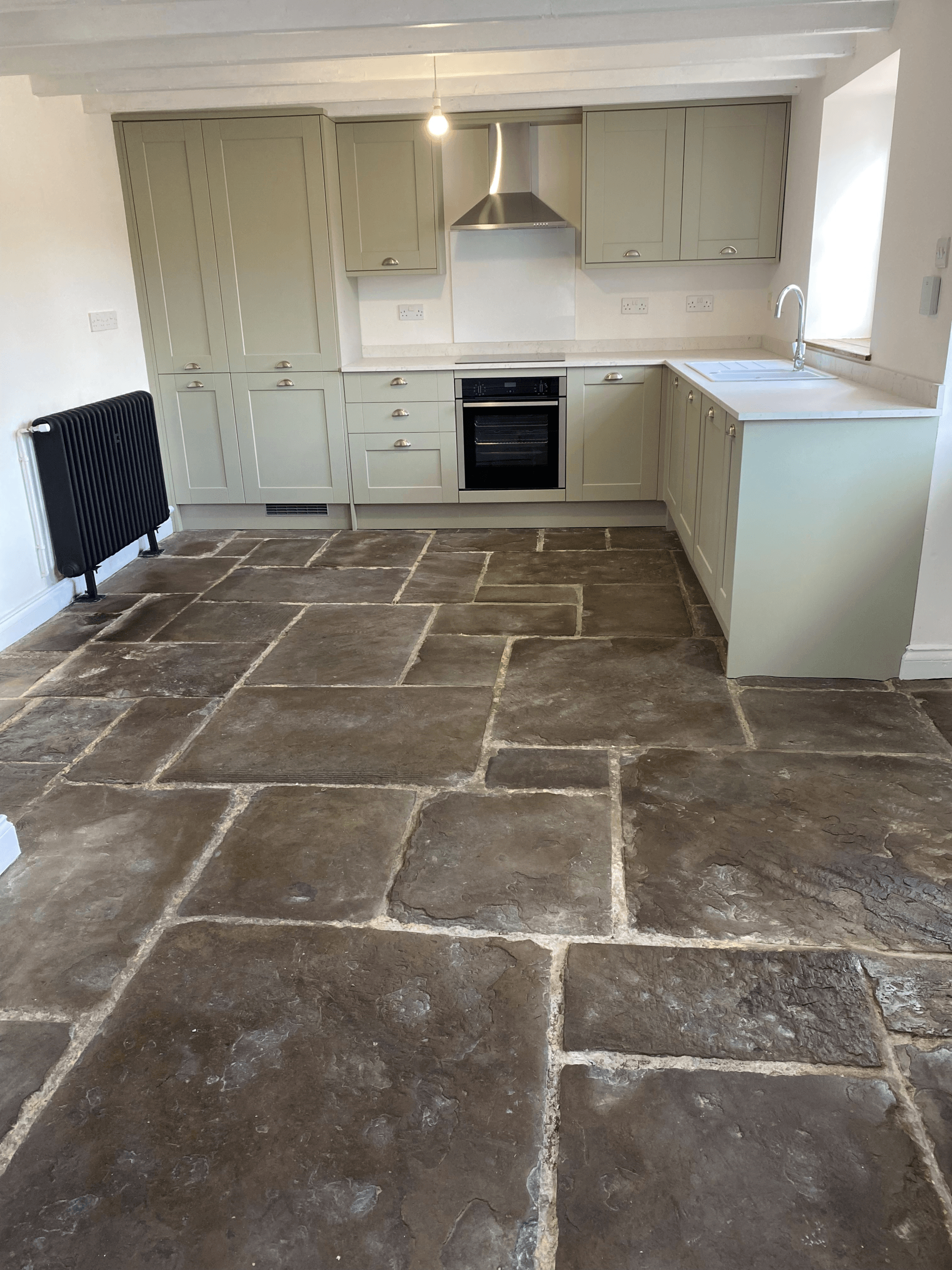 sage green kitchen installation by RTB construction in Cheltenham
