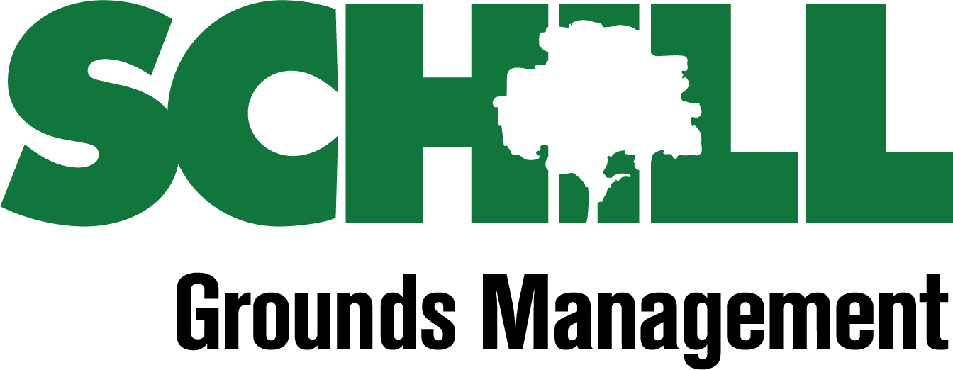 Schill Grounds Management logo in green and black with a tree silhouette in the wordmark