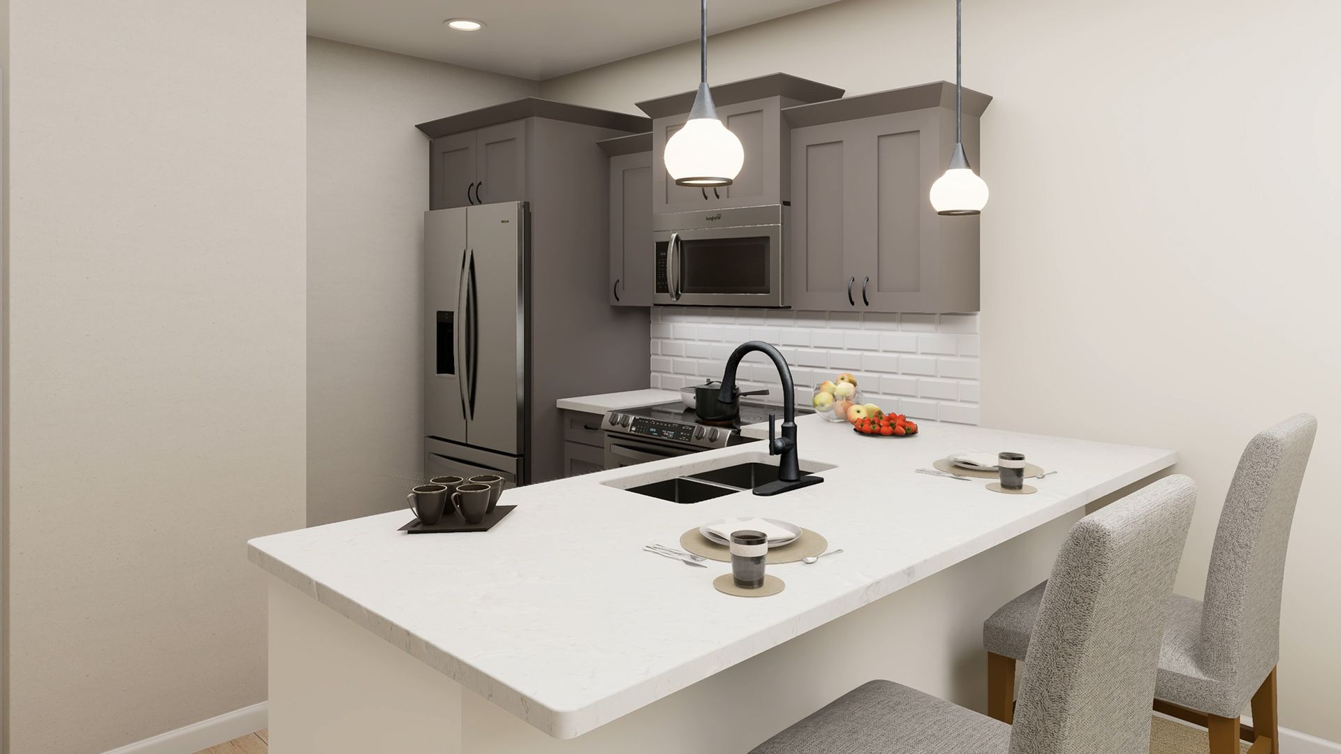 A modern kitchen featuring grey cabinets, stainless steel appliances, a white quartz island with a sink, and two chairs.
