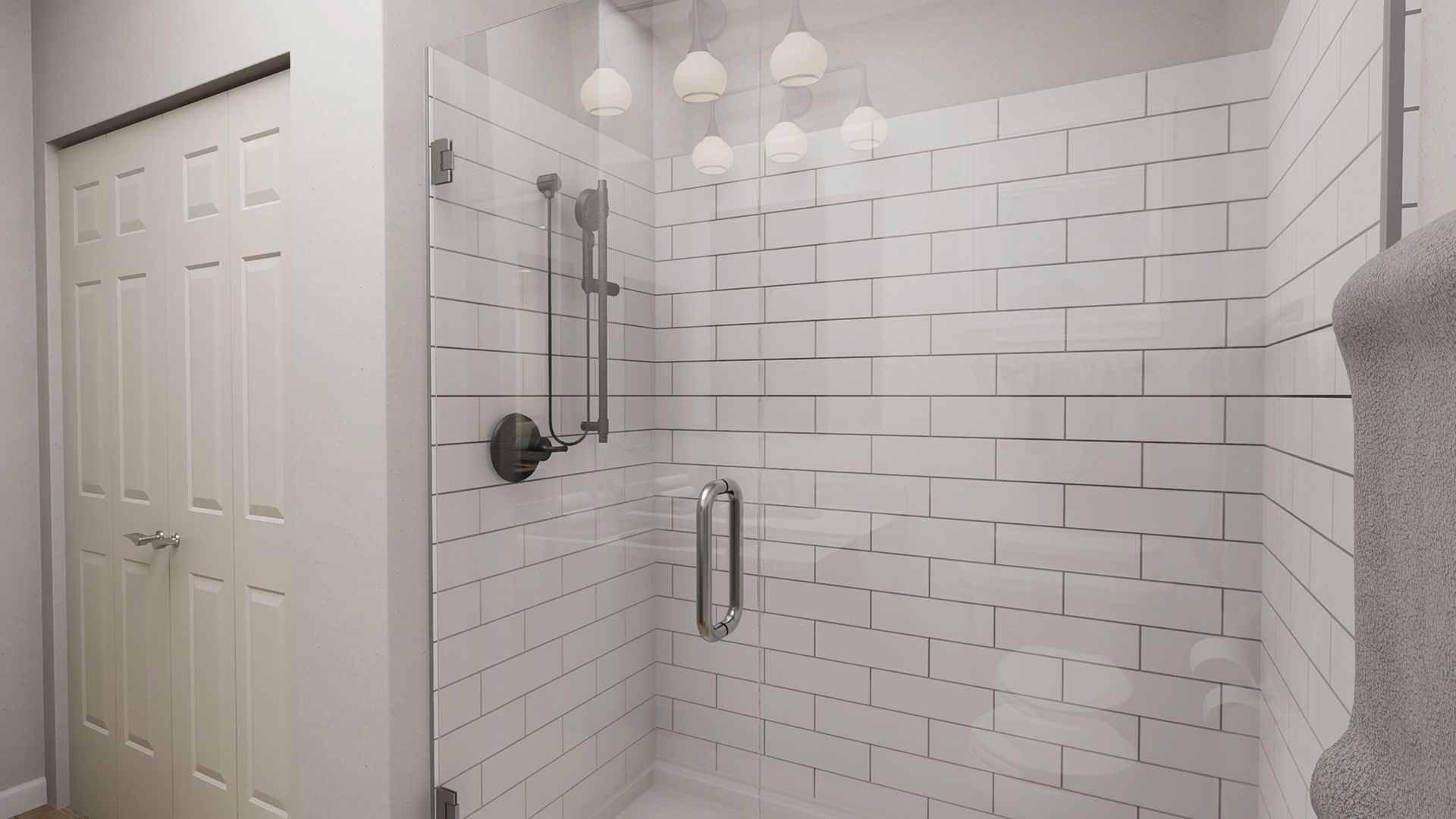 A walk-in shower with white subway tiles, a glass door, and a polished metal shower fixture.