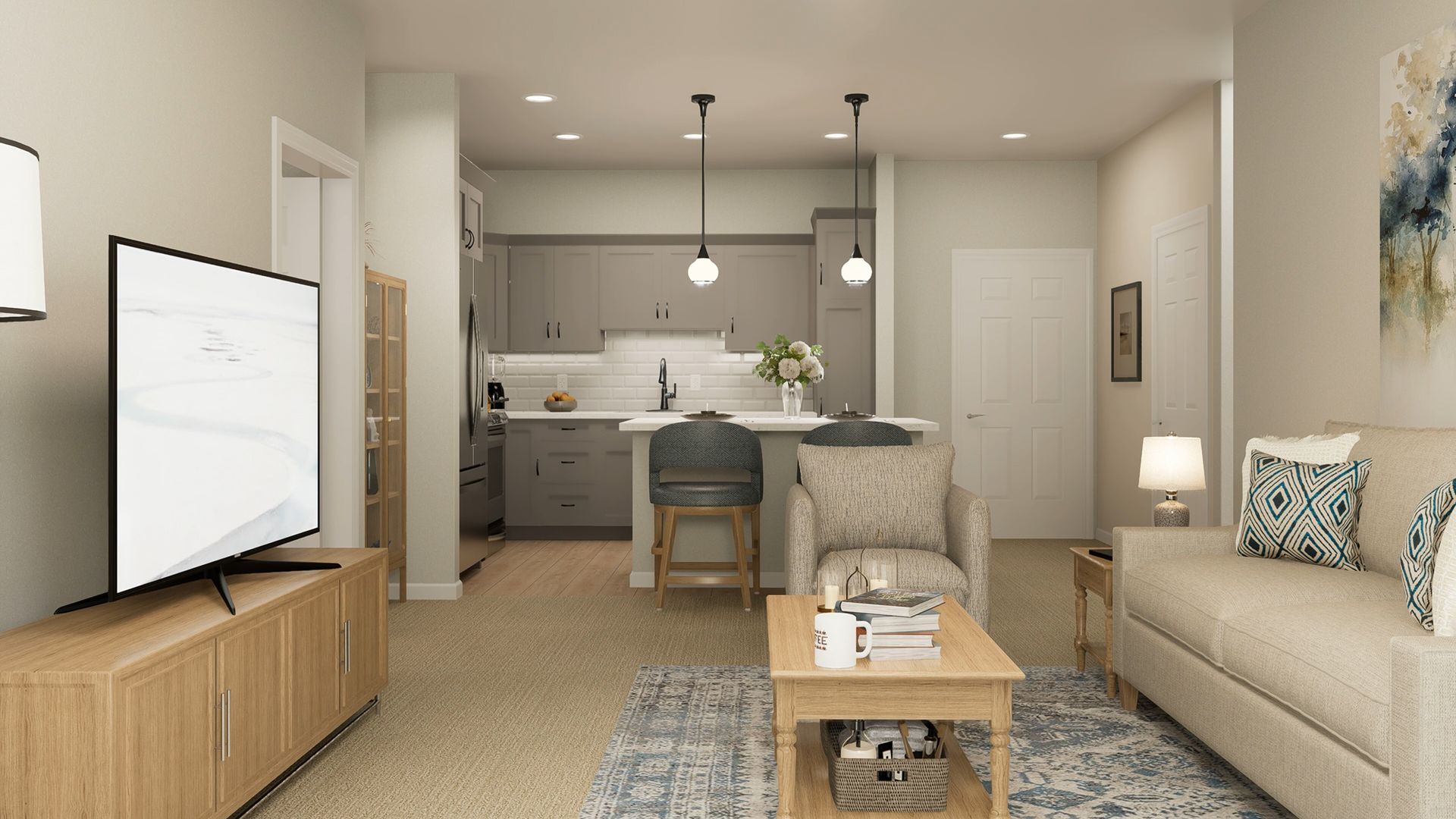 A view of a modern living room with a TV, a couch, a coffee table, and an open kitchen with a breakfast bar.