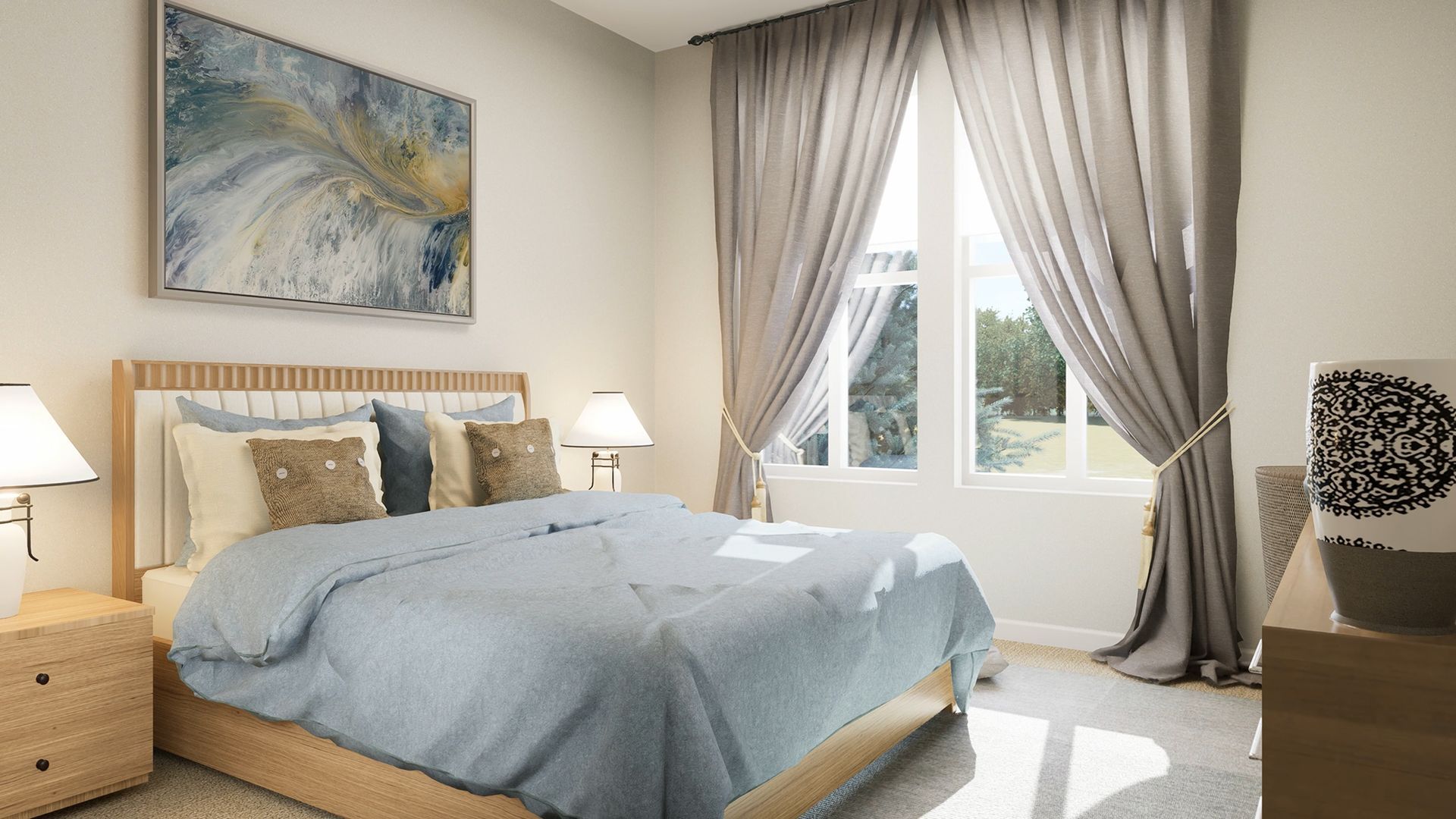 A modern bedroom with a bed featuring a blue quilt, neutral pillows, a wall art piece, and floor-length grey curtains.