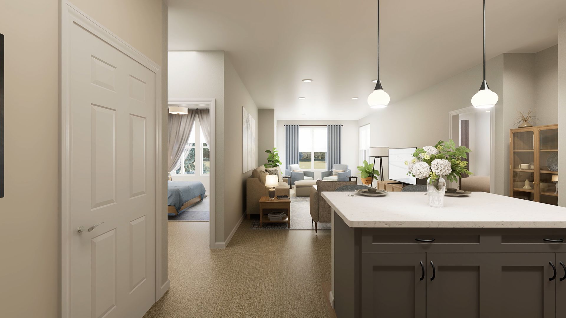 A view from a kitchen island overlooking a living room and a doorway leading to a bedroom in a neutral-toned home interior.