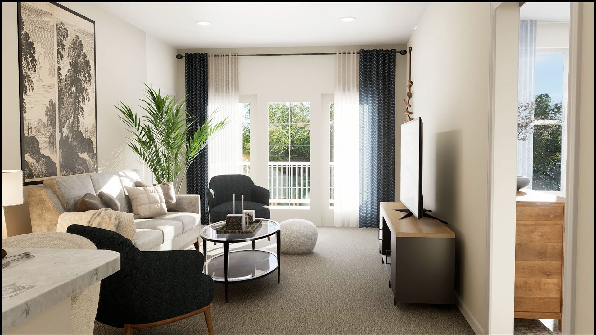 A sunlit living room featuring a beige sofa, two dark armchairs, a round coffee table, and a television on a stand.