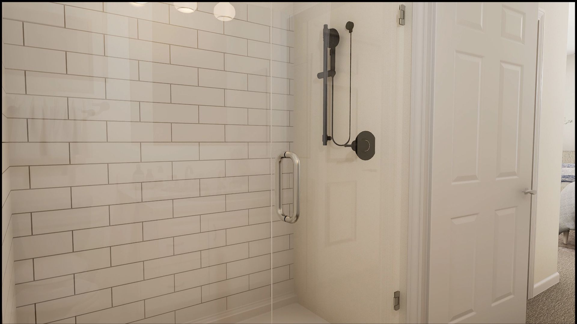 A walk-in shower with white subway tile walls, a glass door with a metal handle, and black shower hardware.
