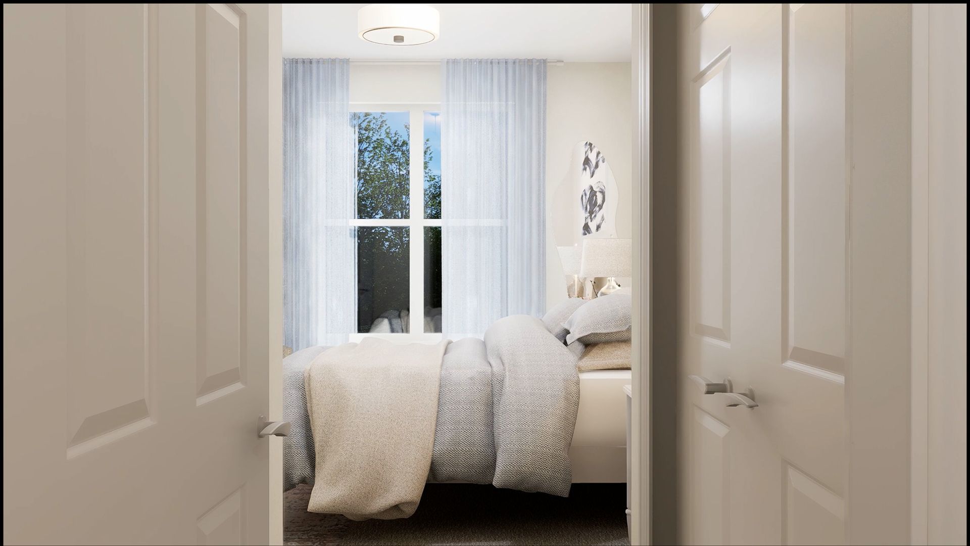 A view through a doorway into a bedroom featuring a bed with patterned linens, light curtains, and a window.