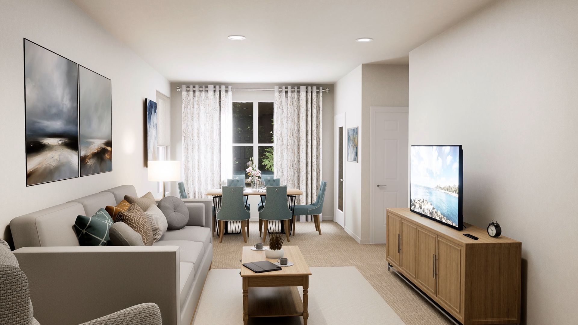 A living and dining room with a gray sofa, wood coffee table, TV console, and blue dining chairs by a window.