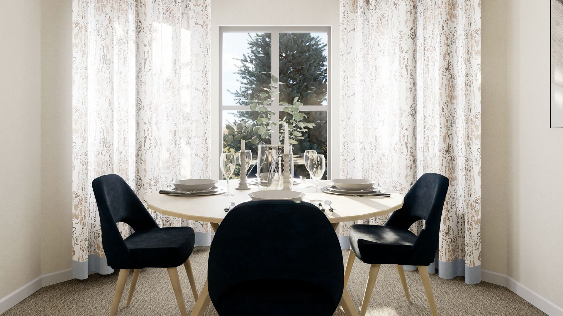 A round dining table with three dark upholstered chairs sits in a bright room with patterned curtains over a window.
