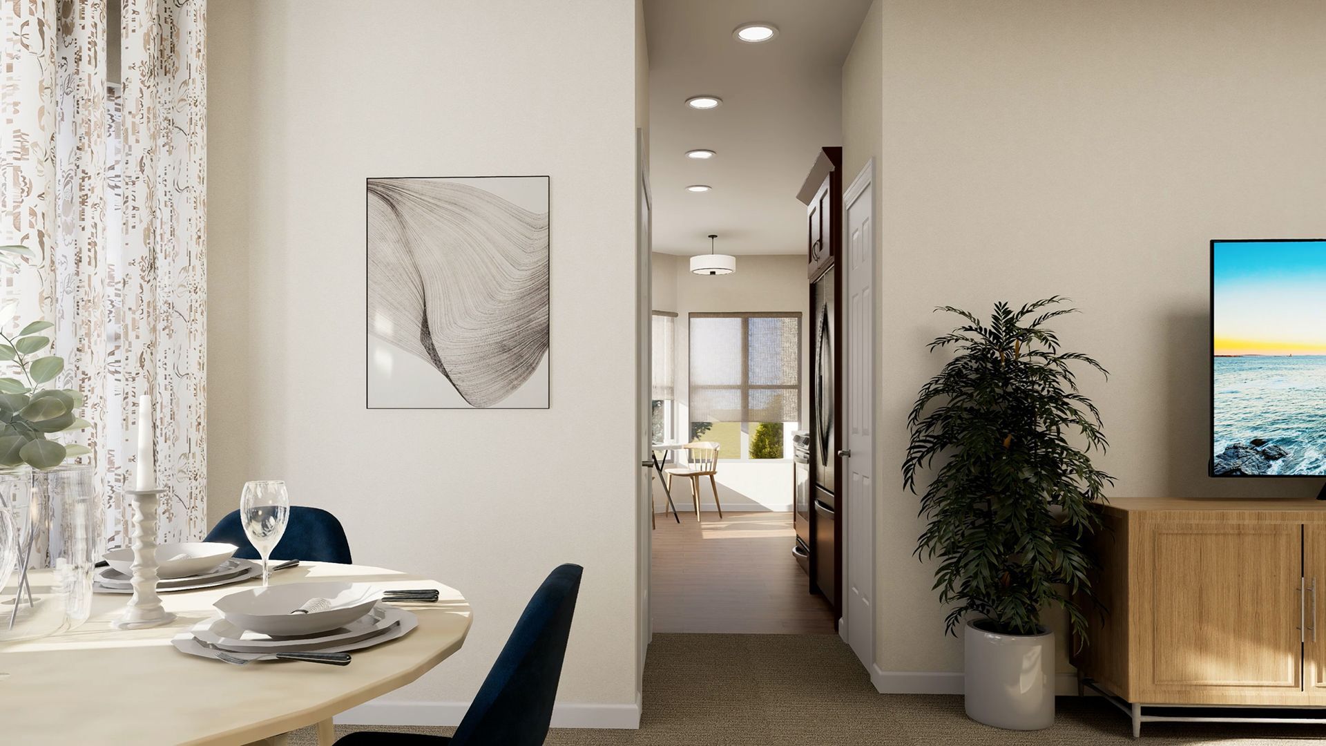 A dining area with a round table in the foreground, leading into a sunlit hallway with a television and plant nearby.