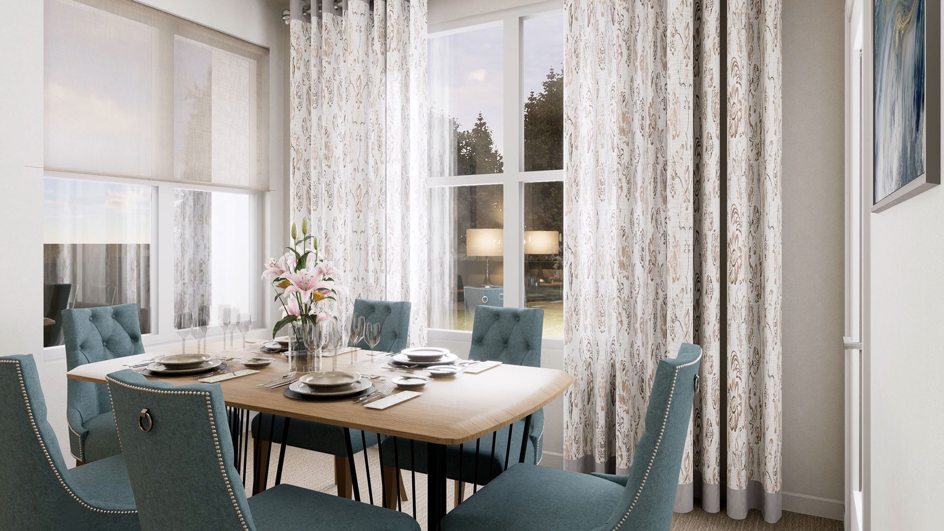 A modern dining room featuring a wooden table, six blue tufted chairs, floral curtains, and a vase of flowers.