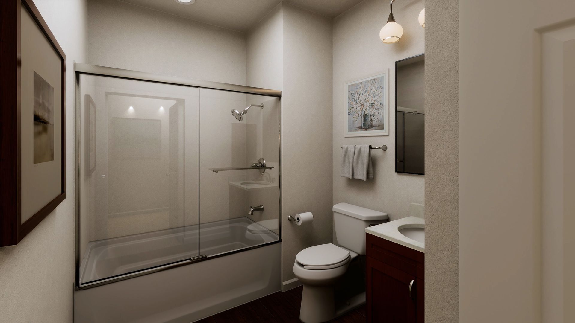 A modern bathroom with a glass-enclosed bathtub, toilet, and wooden vanity with a sink, lit by overhead lights.