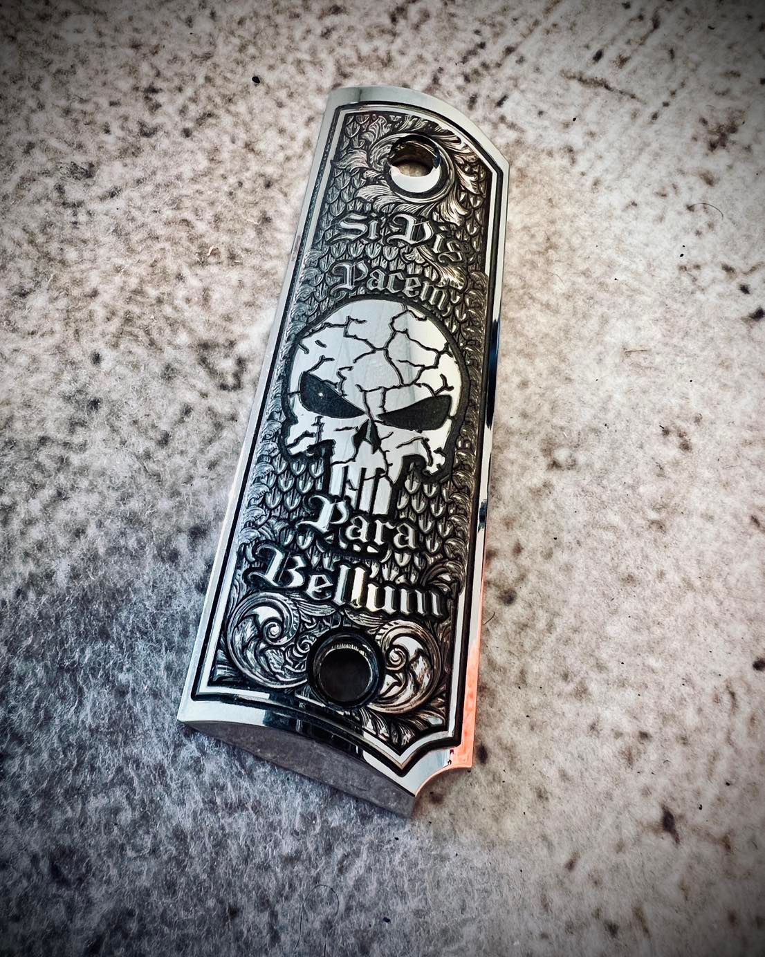 Engraved pistol grip with skull and 