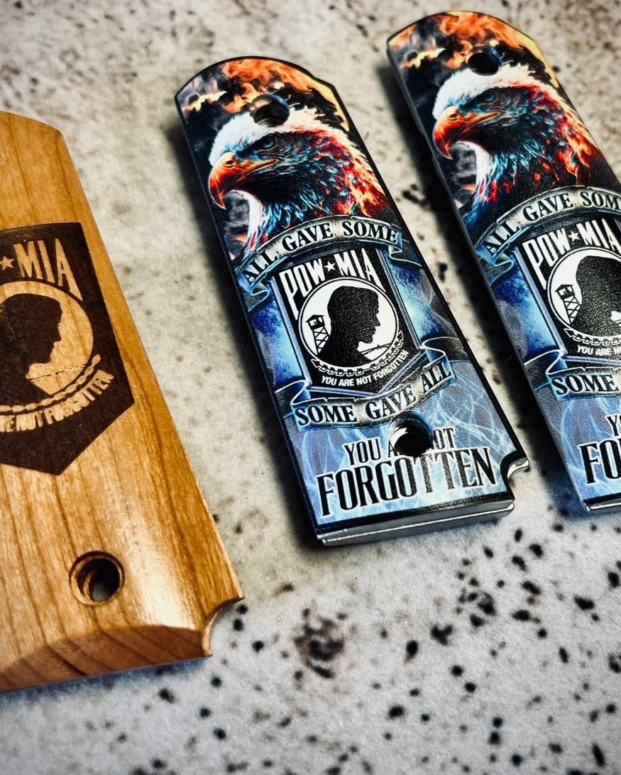 Wooden and custom pistol grips with MIA/POW memorial eagle design. Blue and brown tones.