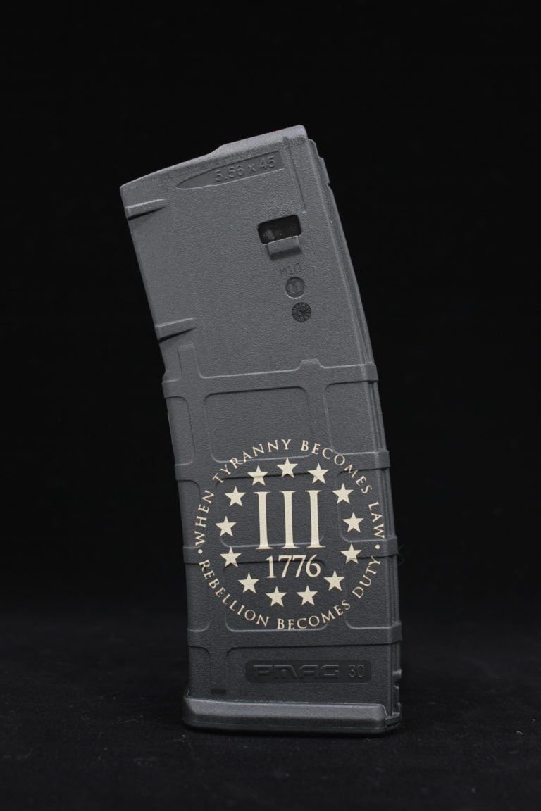 Black silicone phone case with a military-style emblem and “1776” on a black background