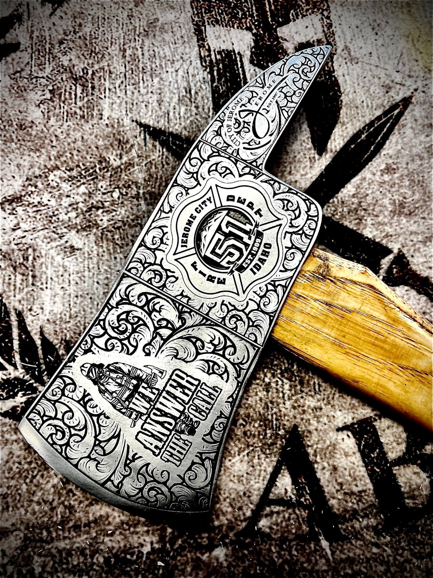 Ornately engraved firefighter's axe, with fire department insignia, on a textured background.
