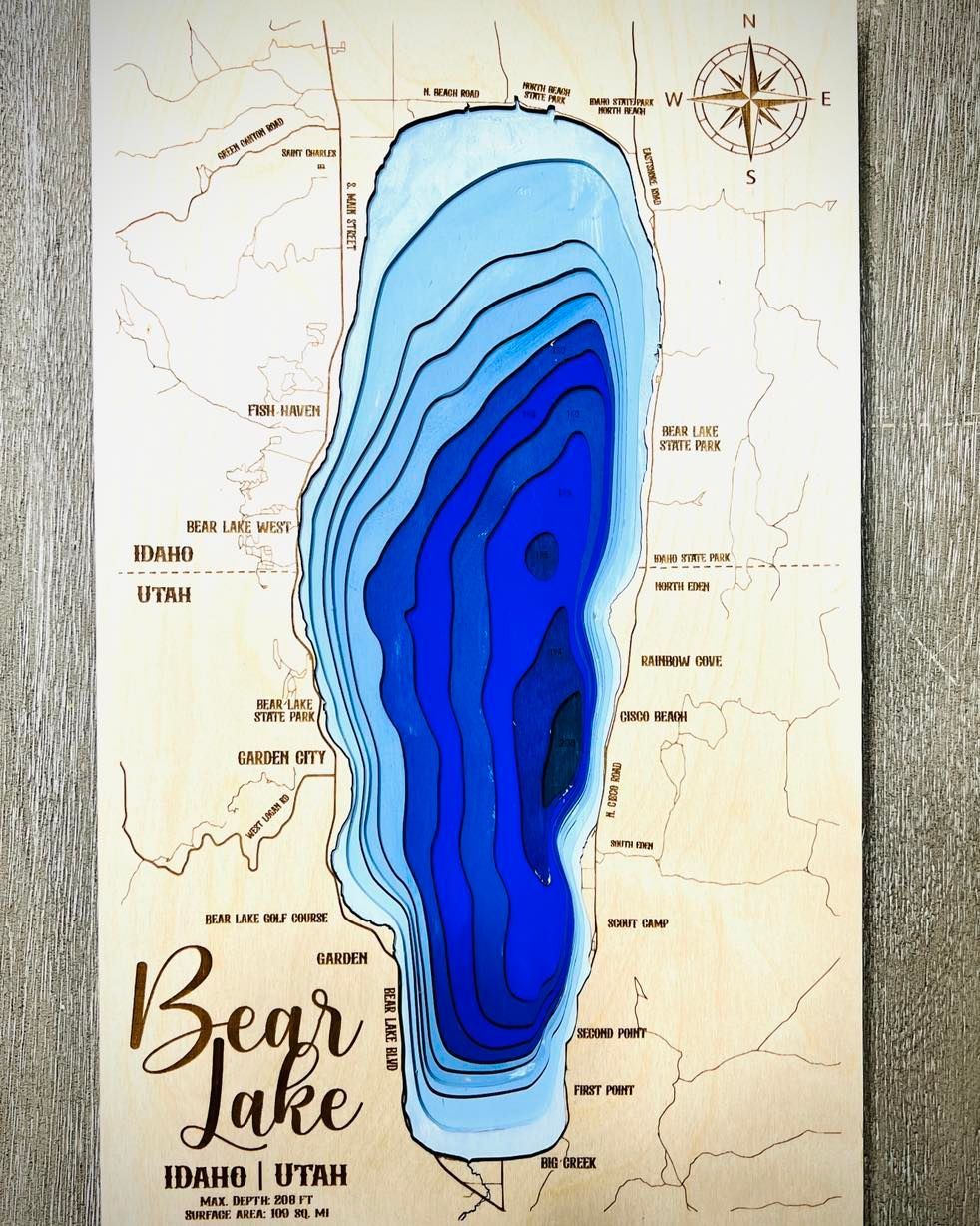 Wood map of Bear Lake, Utah/Idaho, with layered blue depths and surrounding terrain.