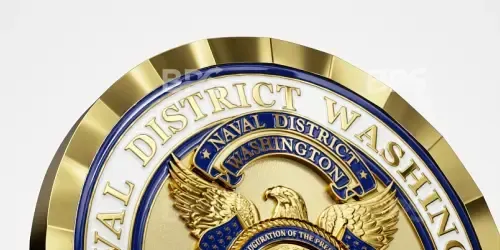 Close-up of a gold-and-blue circular seal with an eagle and the words “District of Washington”