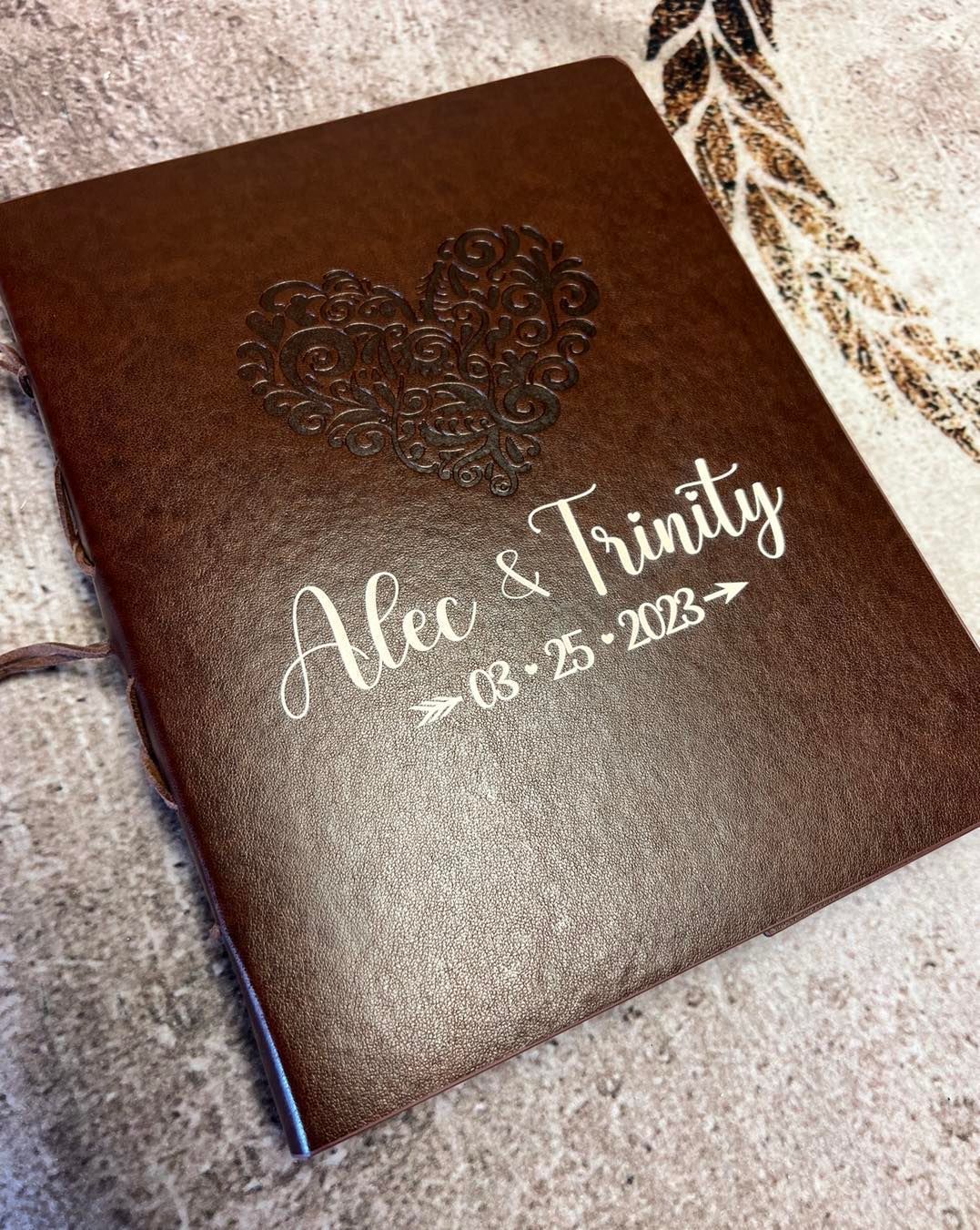 Brown journal with embossed heart and names 