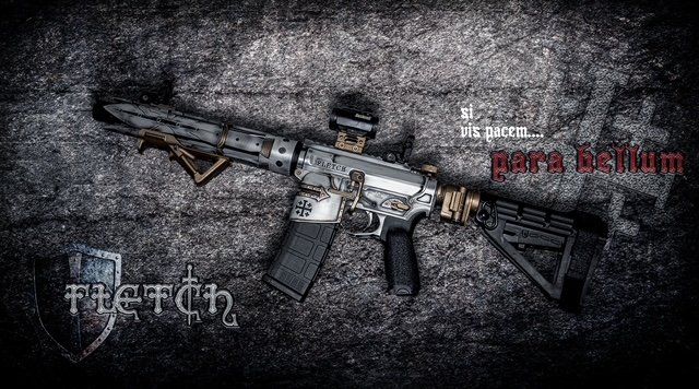 AR-15-style rifle with camouflage pattern, red dot sight, and angled grip, set against a textured background.