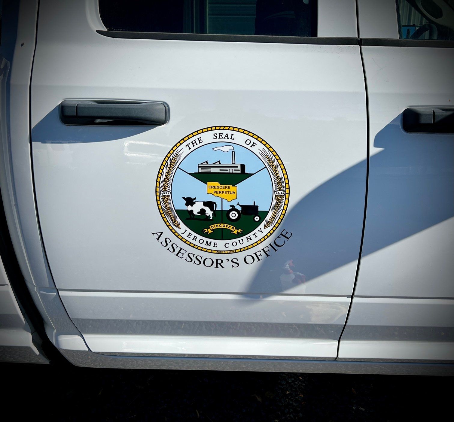 White vehicle door with Teton County Assessor's Office seal.