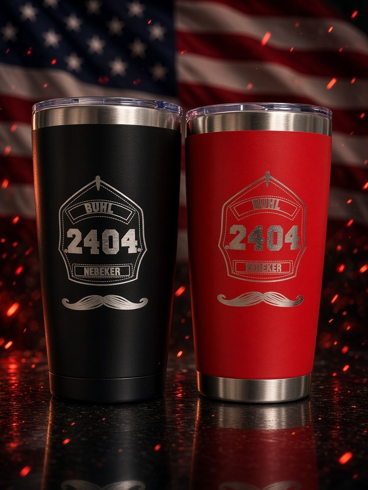 Two insulated tumblers, one black and one red, with “2404” logos on a metal table.