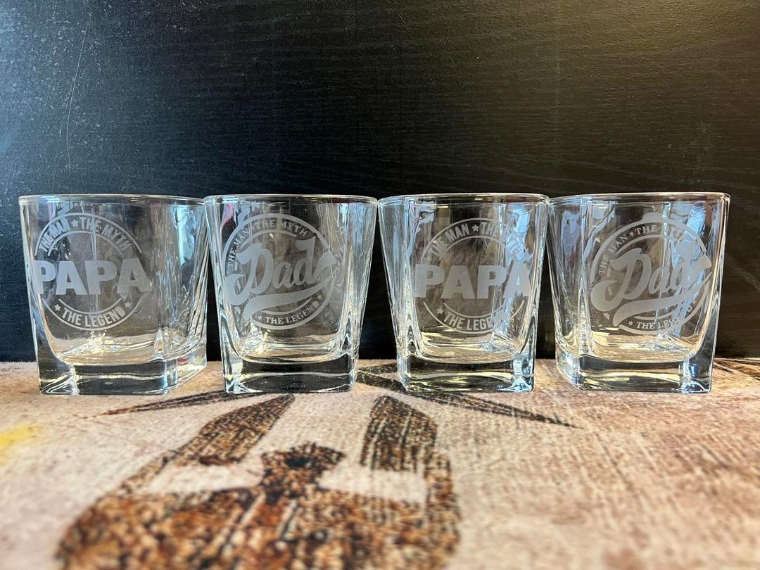 Four engraved shot glasses with 
