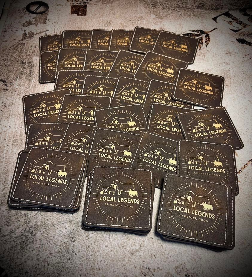 Stacks of brown square coasters with gold 