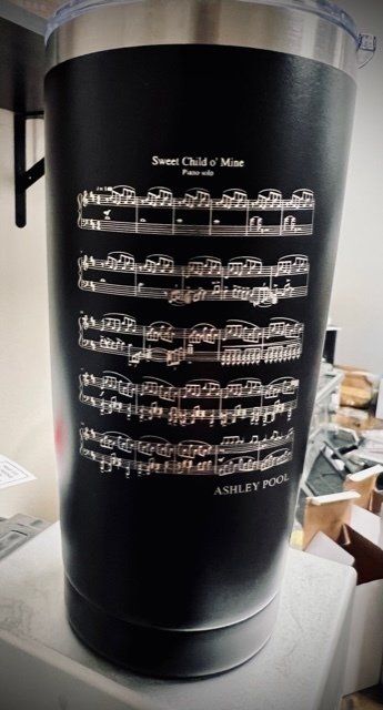 Black tumbler engraved with music notes from 