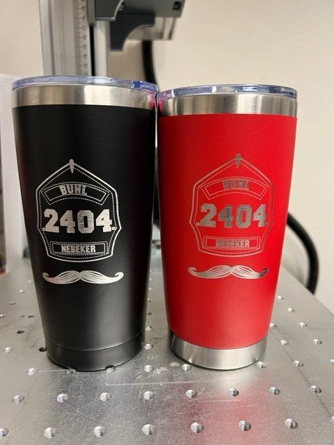 Two engraved insulated tumblers: black and red, with a fireman's helmet design, 