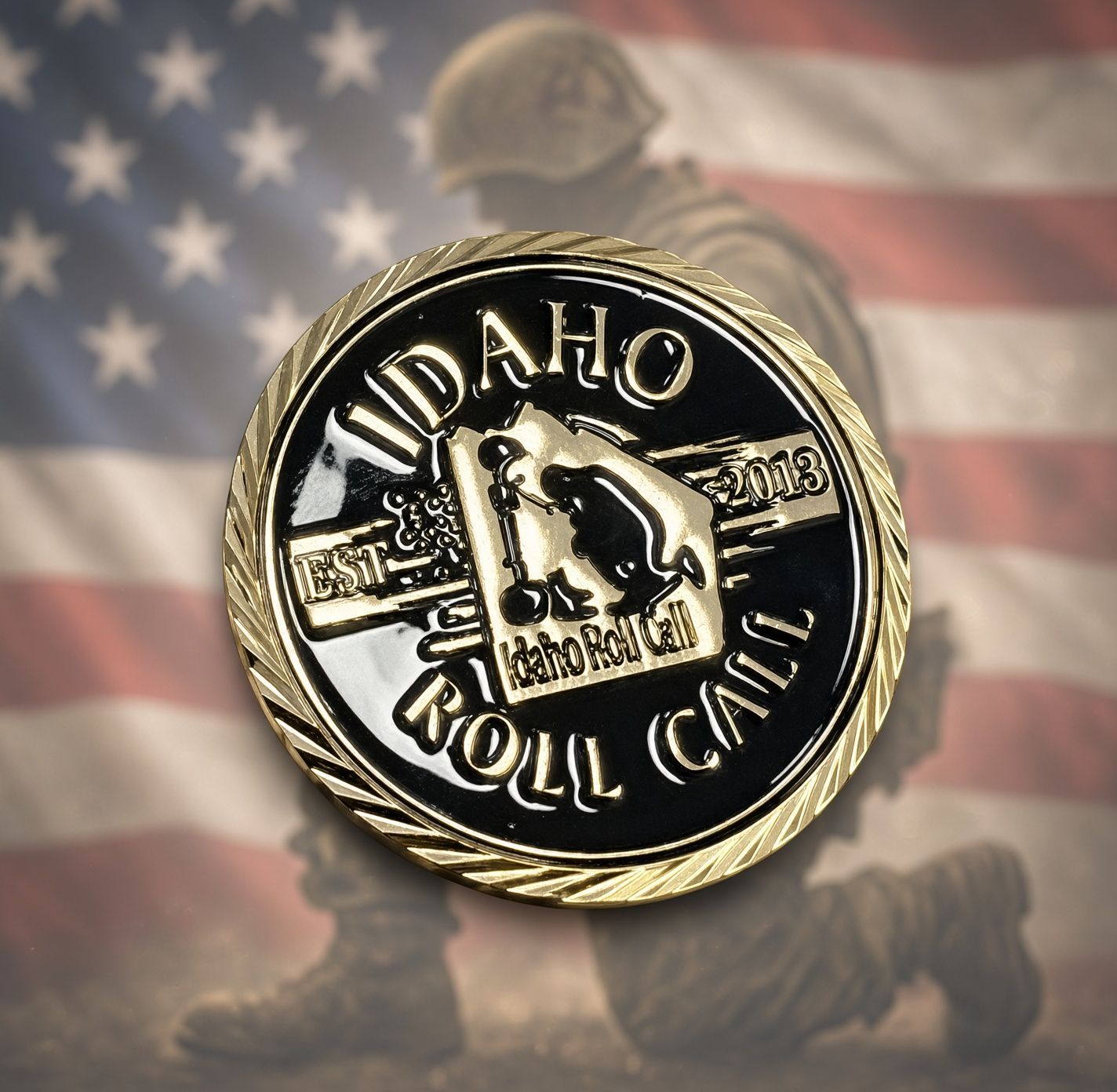 Close-up of a black-and-gold Idaho token on a speckled stone surface with a star-like pattern