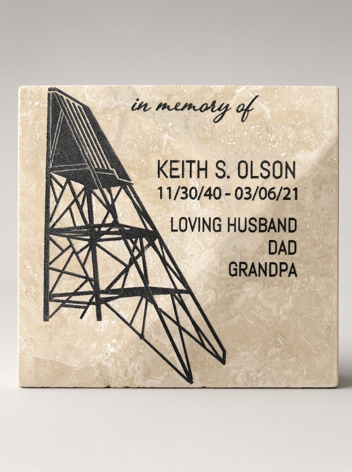 Memorial card for Keith S. Olson with bridge drawing, held in a hand