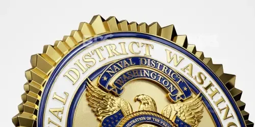 Close-up of a gold and blue District of Washington seal with an eagle crest