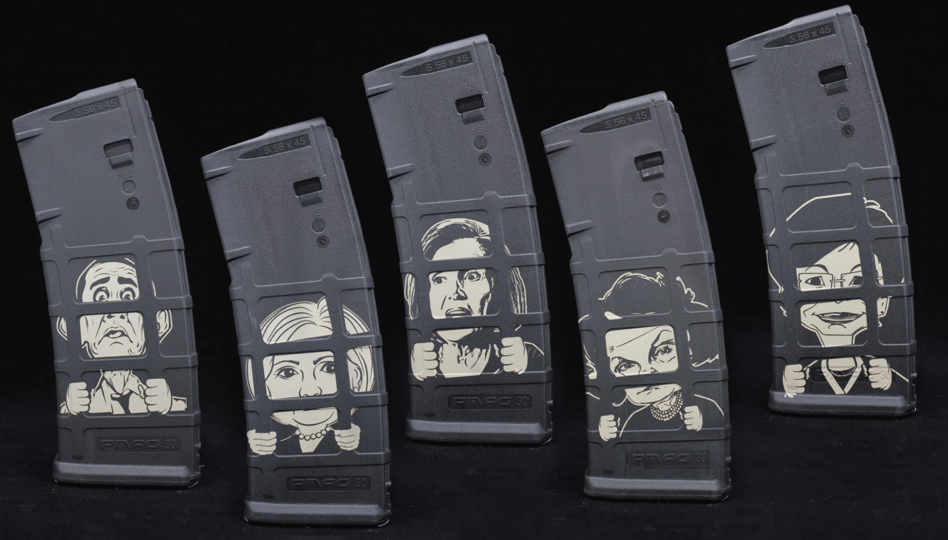 Five black plastic VHS tapes standing upright against a dark background