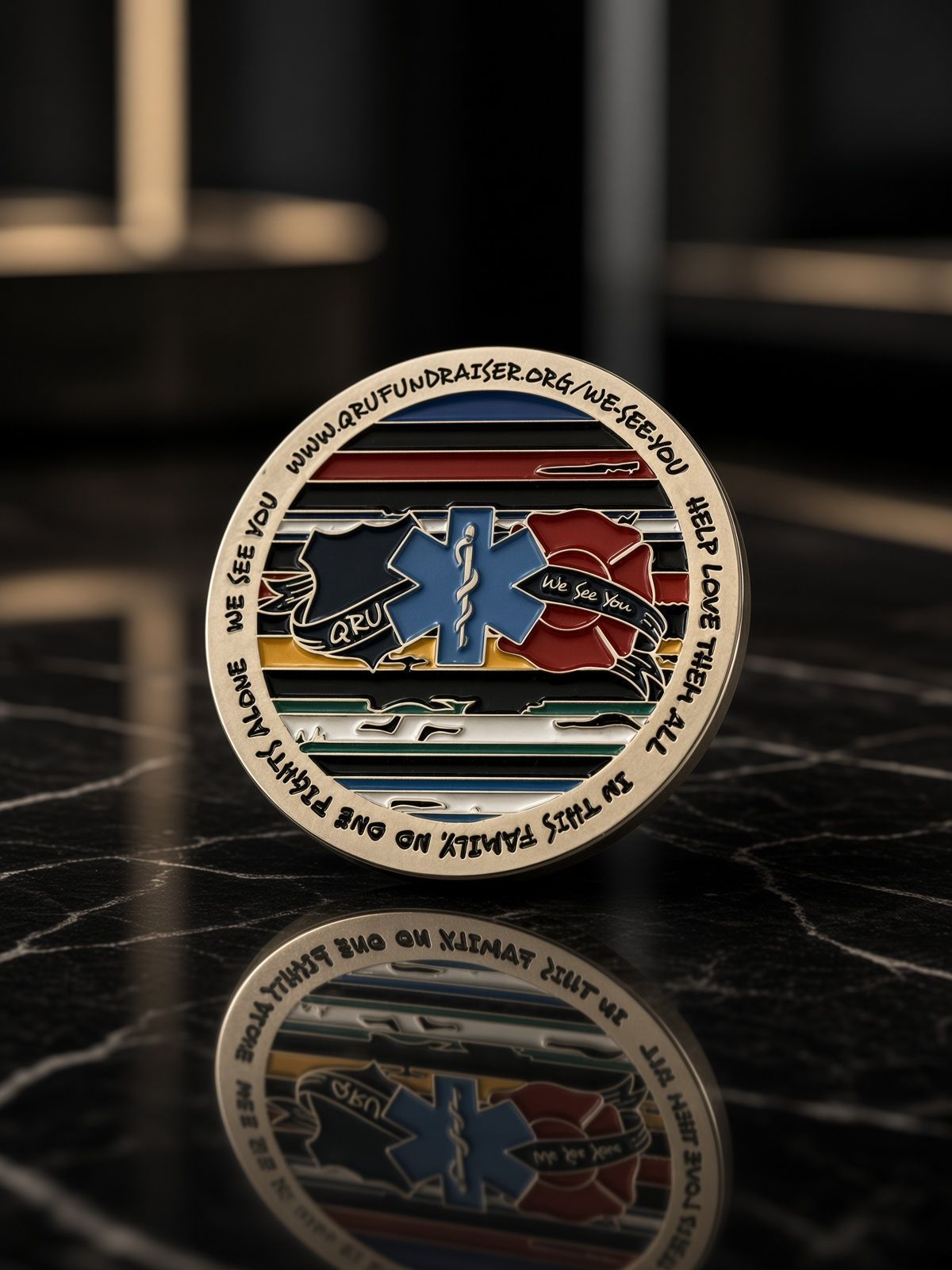 Round commemorative coin with blue and red design, standing on a reflective surface in dim light