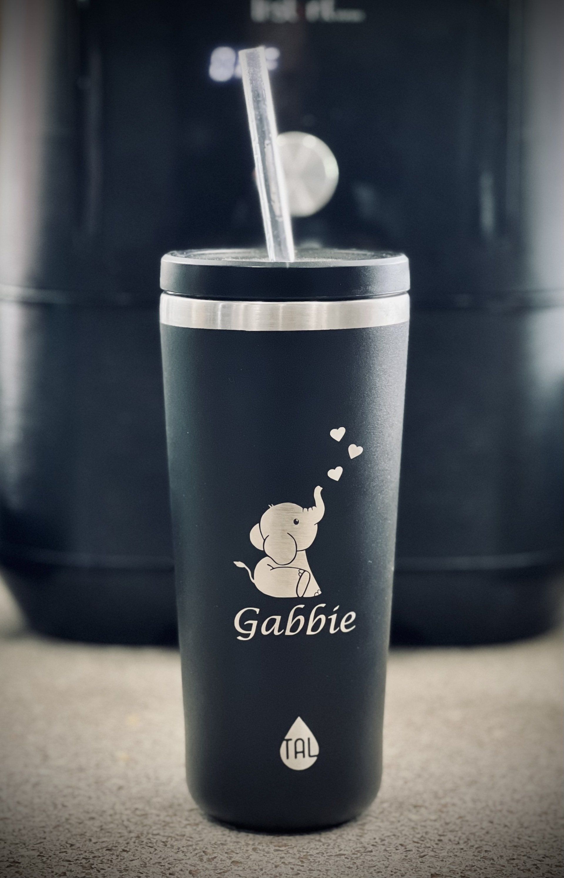 Black tumbler with etched elephant design, name 