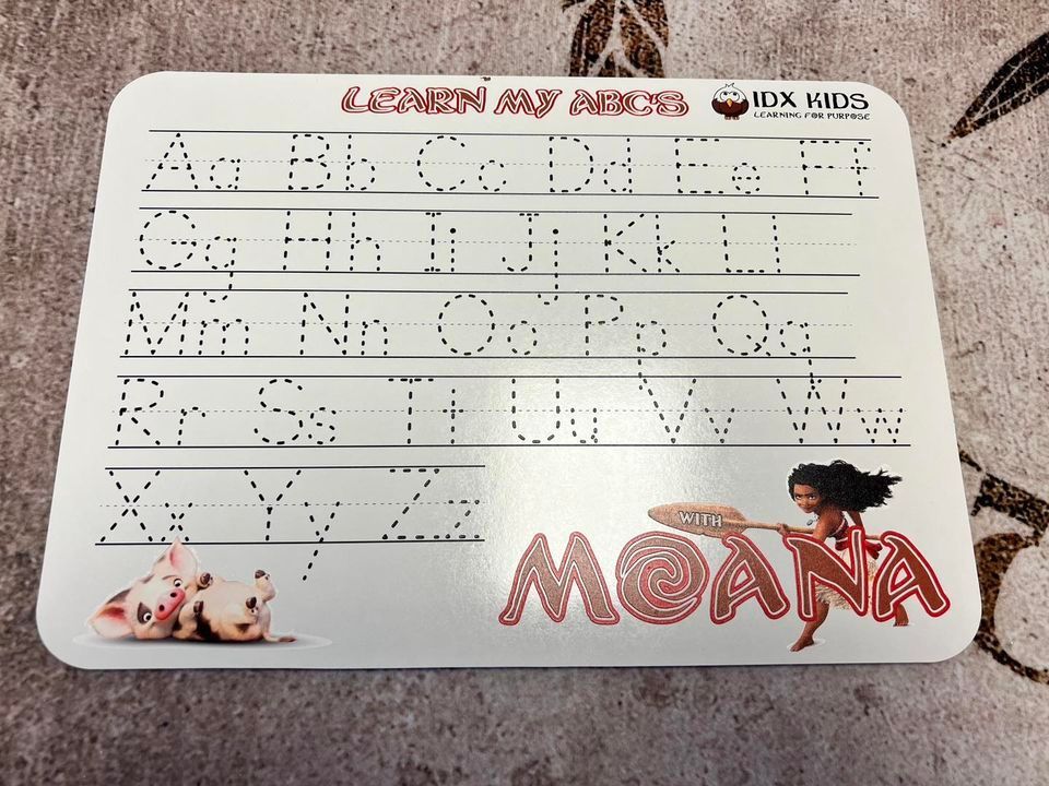 Alphabet tracing board with Moana and Pua graphics.