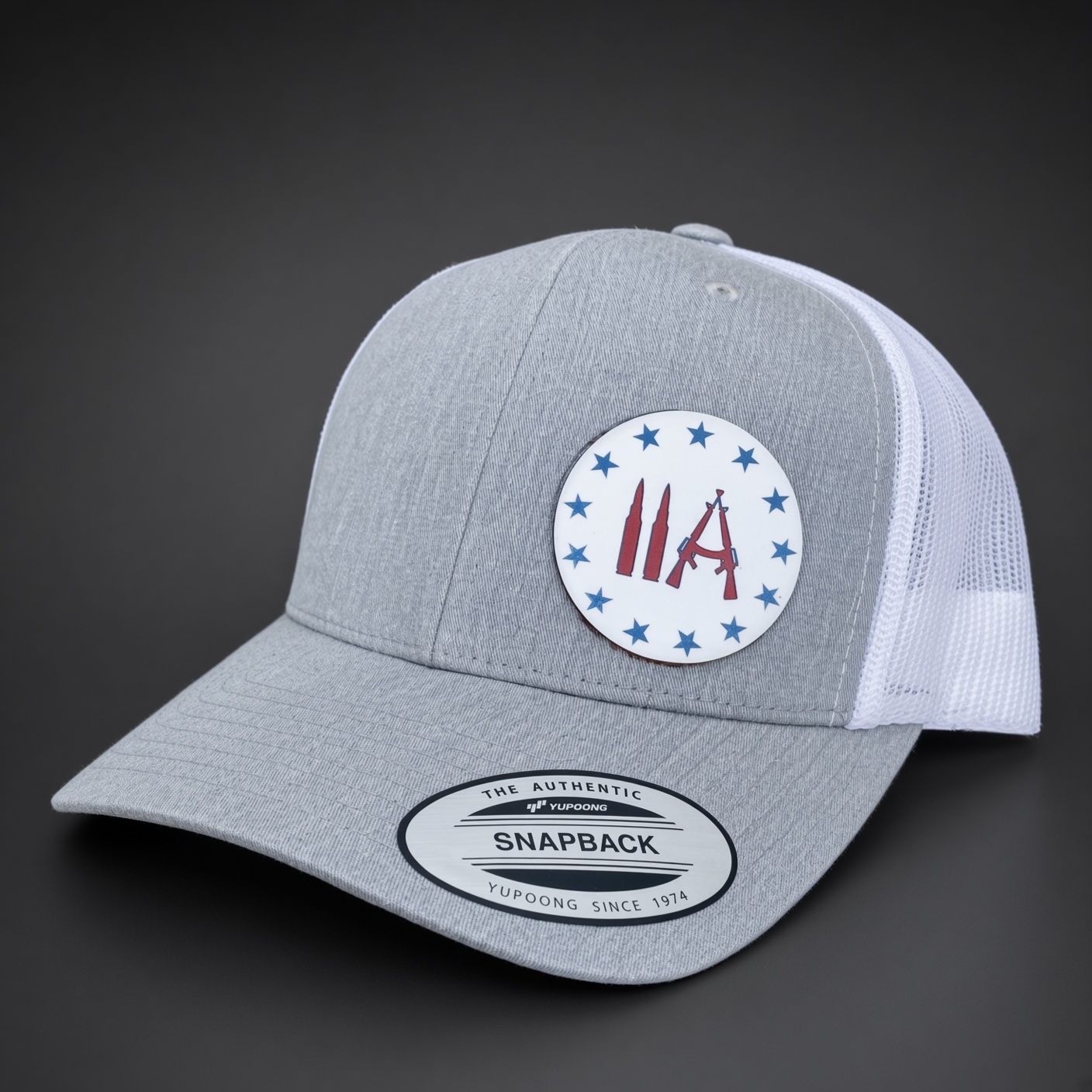 Gray and white mesh snapback cap with a circular USA patch and front brim logo