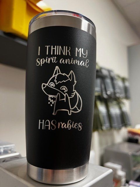 Black tumbler with laser-etched text and cartoon fox that reads, 