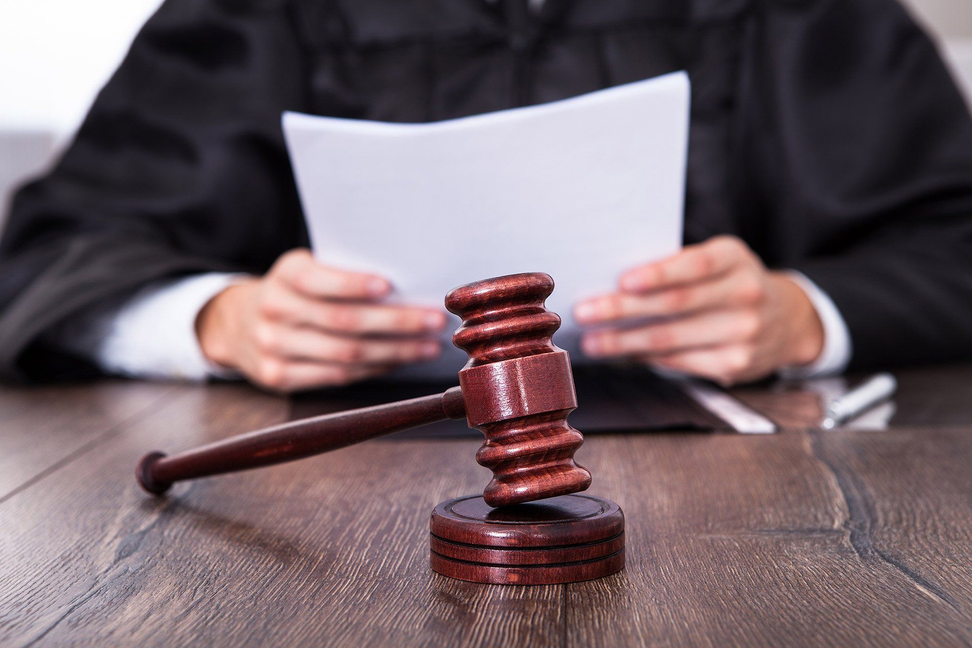 judge reviewing paperwork