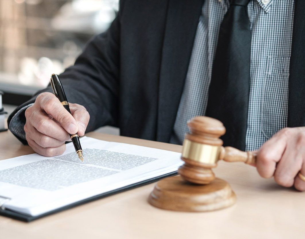 Personal injury attorney signing papers
