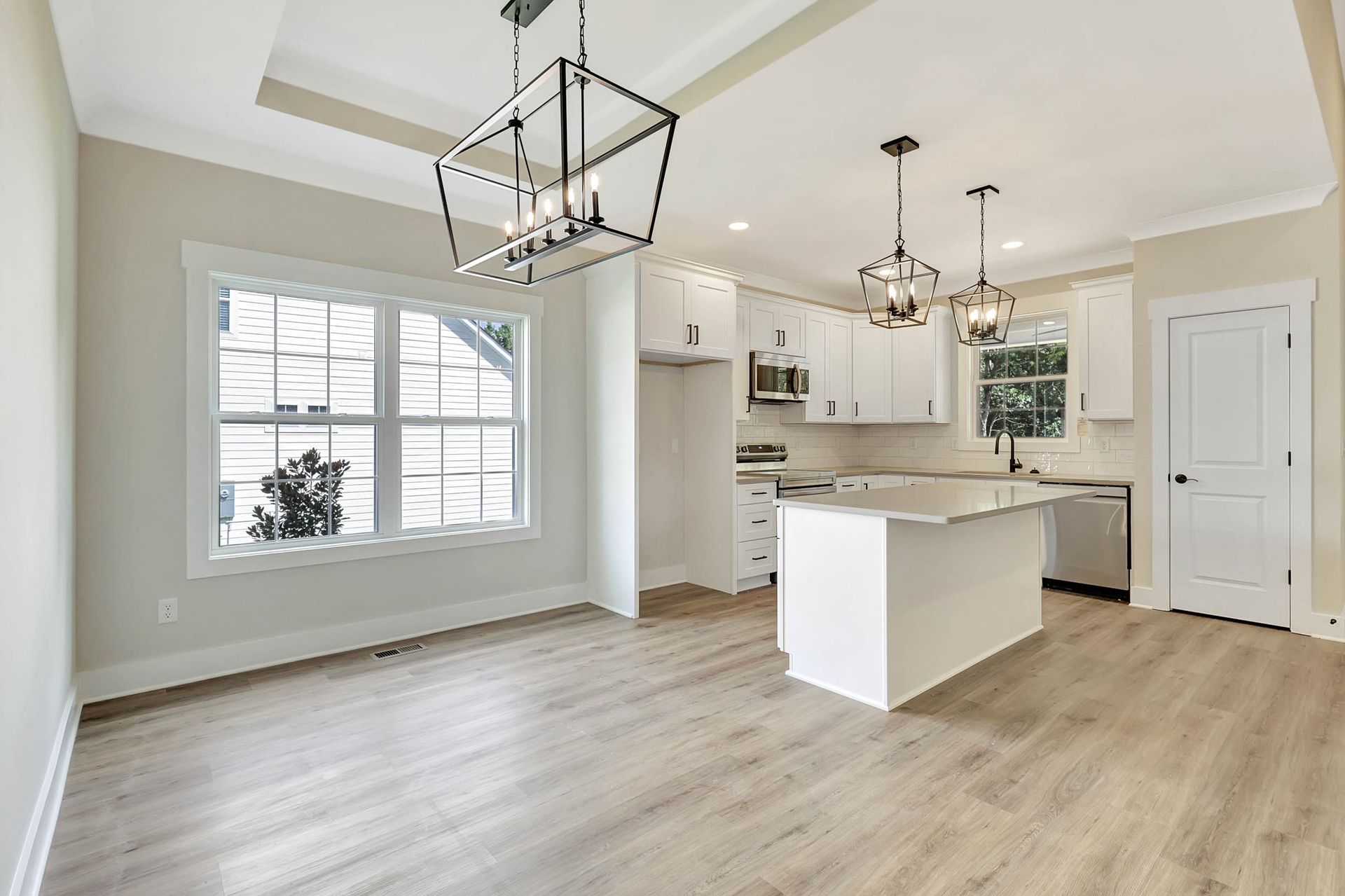 A kitchen with a large island in the middle of the room.