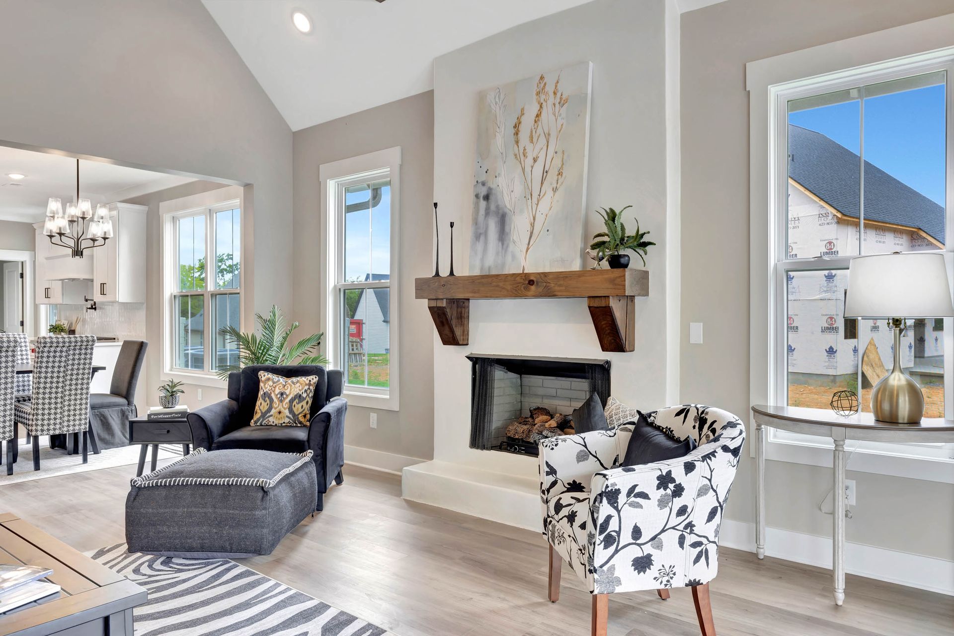 There is a fireplace in the middle of the living room.