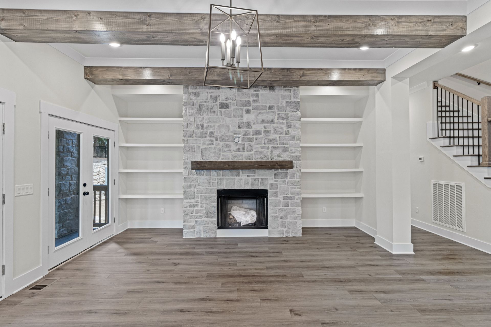 there is a fireplace in the middle of the room .
