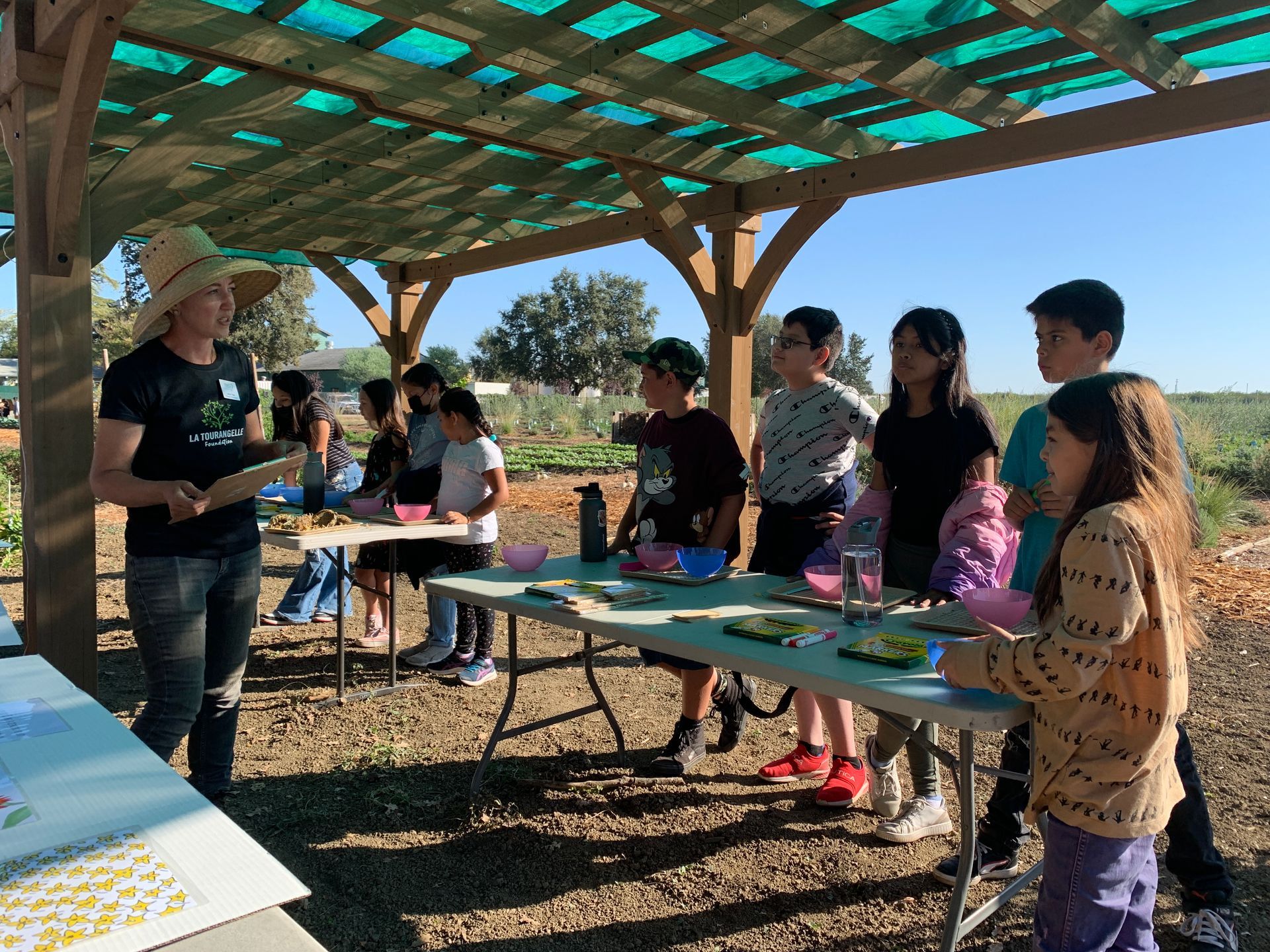 Raley's Sponsored Farm Visits with Yolo Farm to Fork - boy harvesting lettuce